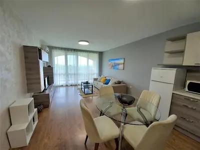 a living room with a glass table and chairs at Sunset in Chernomorets