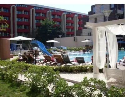 a resort with a slide and chairs and a pool at Privite apartment hotel Admiral plaza in Sunny Beach