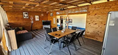 a dining room with a table and chairs at Каравана Сий-я-на in Sozopol