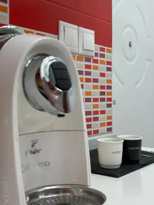 a kitchen counter with a mixer and two cups at Dayanas Suite in Varna City