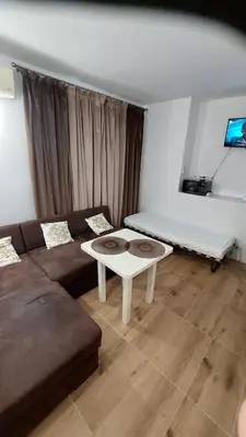 a living room with a couch and a table at Avalon Lux in Sunny Beach