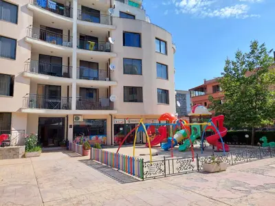 a playground in front of a apartment building at Avalon Lux in Sunny Beach