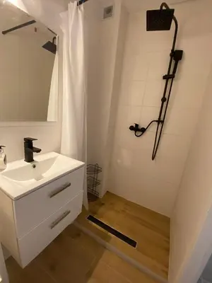 a bathroom with a sink and a shower at Avalon Lux in Sunny Beach