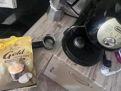 a bag of food sitting next to a coffee maker at Studio 007 с градинка in Burgas City