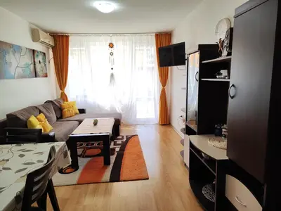 a living room with a couch and a table at Nev 1 in Burgas City