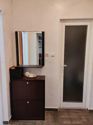 a bathroom with a black door and a mirror at Nev 1 in Burgas City
