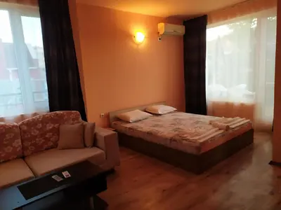 a small bedroom with a bed and a couch at HOUSEDENz in Chernomorets