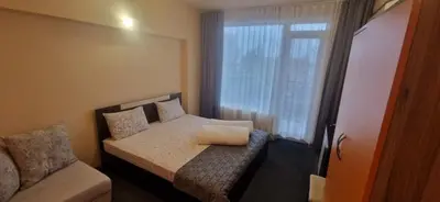 a small bedroom with a bed and a window at HOUSEDENz in Chernomorets