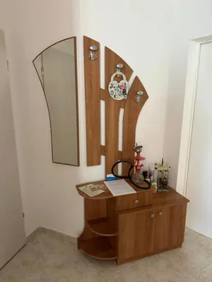 a dressing table with a mirror on a wall at Apartament Sunset Kosharitsa - Slunchev briag in Kosharitsa
