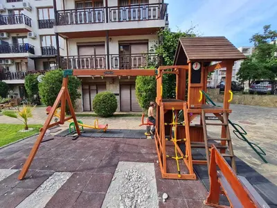a playground with a slide and a play structure at MitProt Panorama Bay 2 Luks Studio 29 in Sveti Vlas