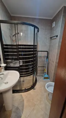 a bathroom with a shower and a sink and a toilet at MitProt Panorama bay 2 Luks Apartment 175 in Sveti Vlas