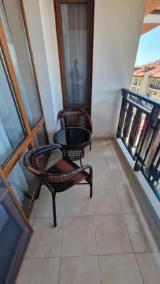 a balcony with two chairs and a table on a balcony at MitProt Panorama bay 2 Luks Apartment 175 in Sveti Vlas