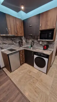 a kitchen with a sink and a stove top oven at MitProt Panorama Bay 2 luks Studio 143 in Sveti Vlas