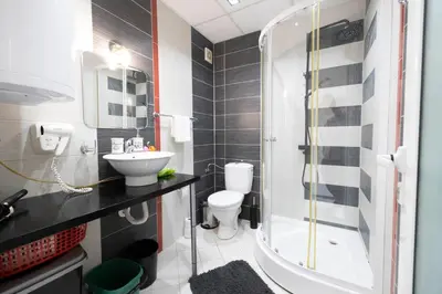 a bathroom with a sink and a toilet and a shower at Reina Apart Kamelia Garden in Sunny Beach
