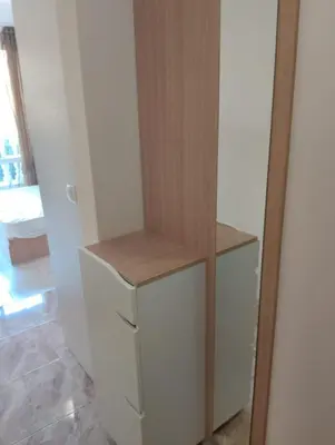 a white cabinet with a wooden counter top in a room at Studio Apartment Villa Sardinia Sveti Vlas in Sveti Vlas
