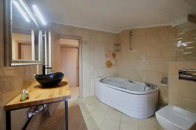 a bathroom with a tub and a toilet and a sink at Florance Rentals Luxury Apartments in Nessebar in Nesebar