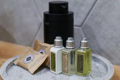 a group of three bottles of soap on a table at Florance Rentals Luxury Apartments in Nessebar in Nesebar