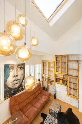 a living room with a couch and a painting on the wall at Apartment Musala N 06 in Varna City