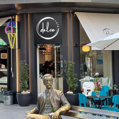 a statue of a man sitting in front of a store at Apartment Musala N 06 in Varna City