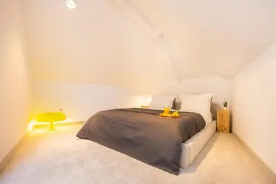 a bedroom with a large bed in a room at Apartment Musala N 06 in Varna City