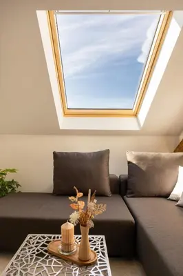 a skylight in a living room with a couch at Apartment Musala N 06 in Varna City