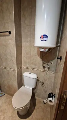 a bathroom with a toilet and a water tank at MitProt Panorama Bay 2 Luks Studio 32 in Sveti Vlas
