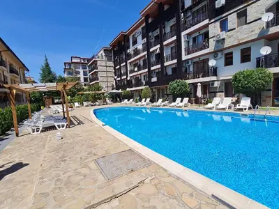 a swimming pool in front of a apartment building at MitProt Panorama Bay 2 Luks Studio 32 in Sveti Vlas