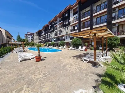 a resort with a pool and chairs and a hotel at MitProt Panorama Bay 2 Luks Studio 32 in Sveti Vlas