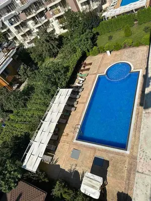an overhead view of a large blue swimming pool at Persani 3 Sanny Beach in Sunny Beach