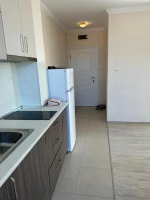 a kitchen with a white refrigerator and a sink at Persani 3 Sanny Beach in Sunny Beach