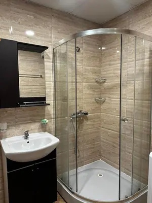 a bathroom with a shower and a sink at Premier Fort Beach Hotel in Sveti Vlas