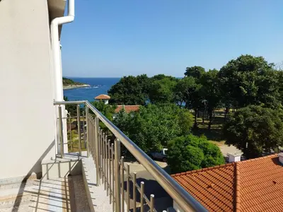 a balcony of a building with a view of the ocean at Lora - Tsarevo in Tsarevo