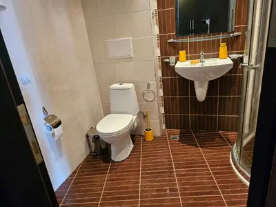 a bathroom with a toilet and a sink at Студио за нощувки в Сарафово in Burgas City