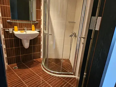 a bathroom with a shower and a sink at Студио за нощувки в Сарафово in Burgas City