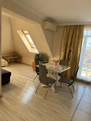 a living room with a table and chairs at Persani 3 Sanny Beach in Sunny Beach
