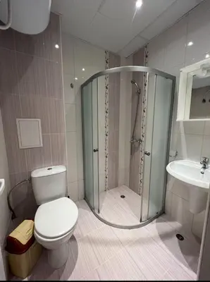 a bathroom with a shower and a toilet and a sink at Студия в Болгарии Солнечный берег in Sunny Beach