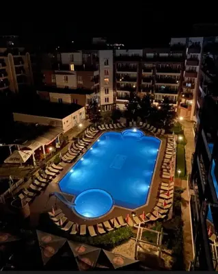 an overhead view of a swimming pool in a building at Студия в Болгарии Солнечный берег in Sunny Beach