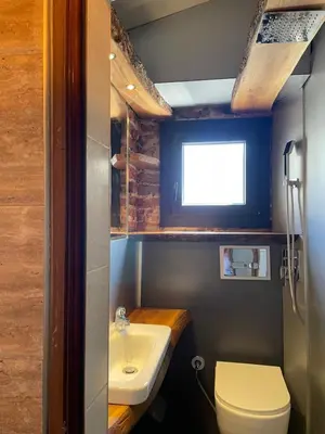 a small bathroom with a toilet and a sink at Art Luxury studio in Burgas City
