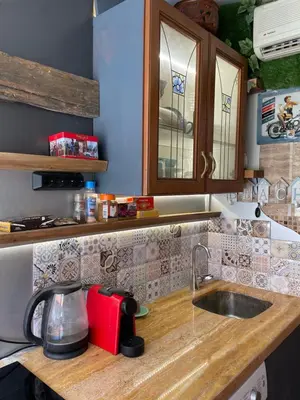 a kitchen with a counter with a sink and a counter top at Art Luxury studio in Burgas City