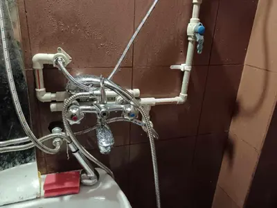 a shower in a bathroom next to a sink at На пъпа на Варна, голяма стая! in Varna City