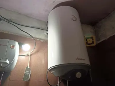 a soap dispenser on the wall of a bathroom at На пъпа на Варна, голяма стая! in Varna City