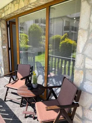 two chairs and a table on a patio at К-с Сън Коуст in Sveti Vlas