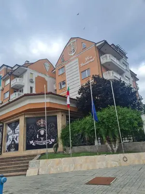 a building with flags in front of it at Sea Diamond Family Suite in Sunny Beach