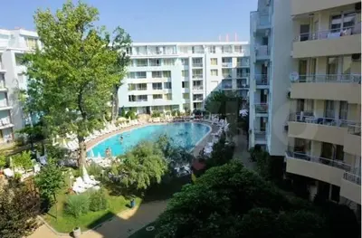 an overhead view of a swimming pool next to a building at Yassen Sunny Beach in Sunny Beach