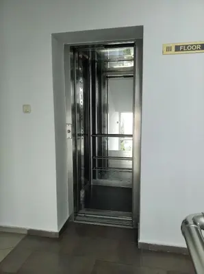 an elevator door in a building with a window at Yassen Sunny Beach in Sunny Beach