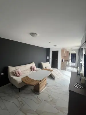 a living room with a couch and a coffee table at Modern Penthouse Apartment with full Sea View K&R in Sveti Vlas