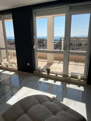 a room with windows and a view of the ocean at Modern Penthouse Apartment with full Sea View K&R in Sveti Vlas