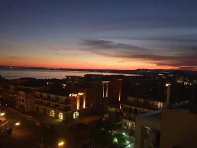 a view of a city at night at Modern Penthouse Apartment with full Sea View K&R in Sveti Vlas