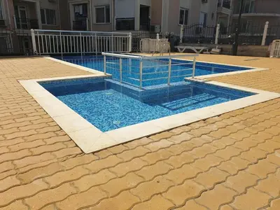 a swimming pool with blue water in a building at Modern Penthouse Apartment with full Sea View K&R in Sveti Vlas