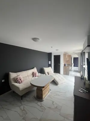 a living room with two couches and a table at Modern Penthouse Apartment with full Sea View K&R in Sveti Vlas